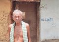 Nityananda Deep standing outside his home which has been marked for demolition