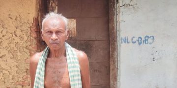 Nityananda Deep standing outside his home which has been marked for demolition