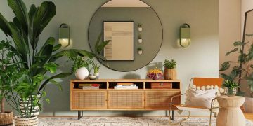 Sandbags piled in front of the door of a house to protect against flooding from a natural disaster.