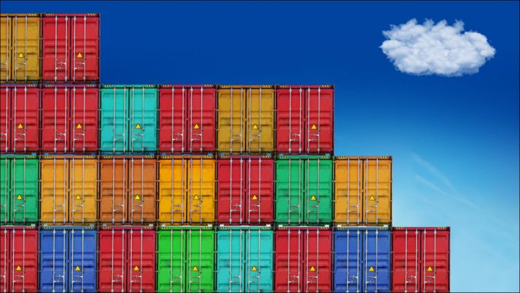 Photo of coloured shipping containers against a blue sky