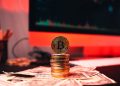 Investors yank a record US$453 mln from Bitcoin: report, Bitcoin on a home computer chart and money and investment