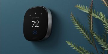 An Ecobee smart thermostat on a living room wall.