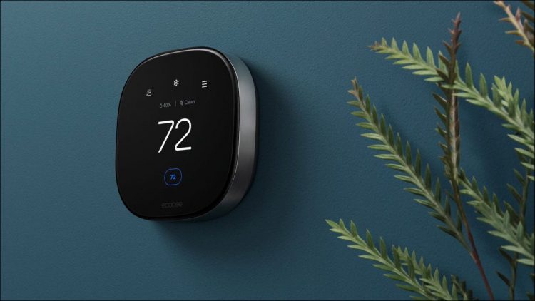 An Ecobee smart thermostat on a living room wall.