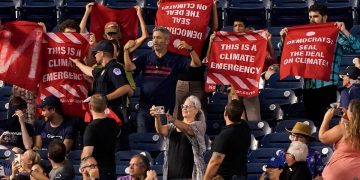 Activists rally outside congressional baseball game they vowed to ‘shut down’ amid Schumer-Manchin climate deal