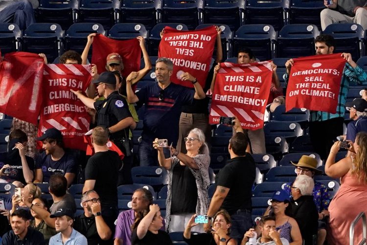 Activists rally outside congressional baseball game they vowed to ‘shut down’ amid Schumer-Manchin climate deal