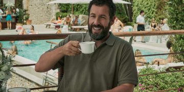 Adam Sandler drinking a coffee and laughing in Netflix's Hustle