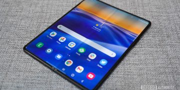 Samsung Galaxy Z Fold 3 angled screen open couch