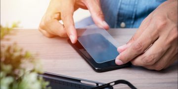 Screen protector being applied.