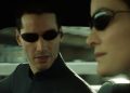 Image of a virtual Neo and Trinity from the Matrix, driving in a car wearing sunglasses.
