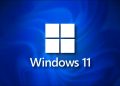 Windows 11 logo on a dark blue shadow background