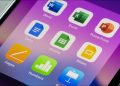 An iPhone screen showing various Microsoft Office and Apple productivity apps together.
