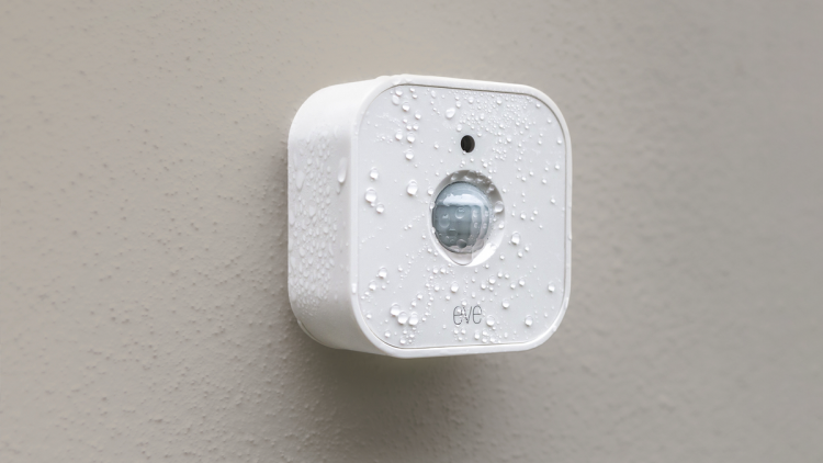 The second-gen Eve Motion sensor sprinkled with water.