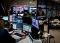 A newsroom in Europe with computer screens