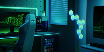 A gaming desk with Razer devices and Govee light panels.