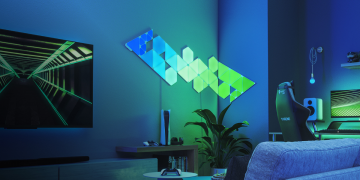 A set of Nanoleaf Shapes panels on a living room wall.