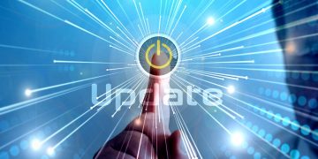 A hand flicks on an update switch. [ software update / fix / patch ]