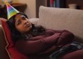 Never Have I Ever Season 3 Devi frowning on couch with birthday hat