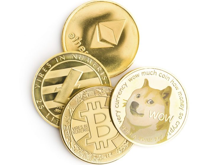 Dogecoin, litecoin, ethereum and bitcoin isolated on white background.