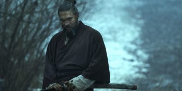 Jason Momoa as Baba Voss about to unsheath a sword in See