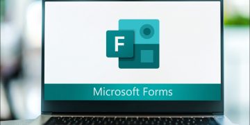 A laptop screen showing the Microsoft Forms logo.