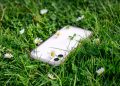 Phone in grass.