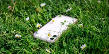 Phone in grass.