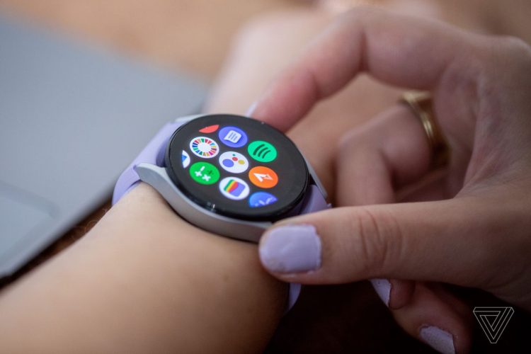 The Galaxy Watch 5 screen showing third-party apps like Google Assistant, Spotify, Strava and Calm