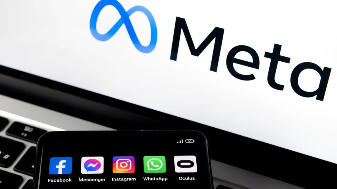 Silhouette of smartphone with Facebook, Messenger, whatsApp, Instagram, Oculus apps and blurred META logo on background.