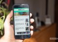 iPhone SE 2022 review second opinion in hand with android authority website