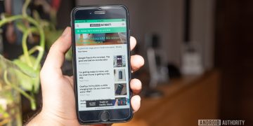 iPhone SE 2022 review second opinion in hand with android authority website