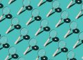 Magnifying Glass Focusing Sunlight Into a Point Repetition on Turquoise Colored Background High Angle View; technical due diligence