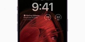 iPhone 14 Pro's always-on display dims the wallpaper and shows the Lock Screen widgets.