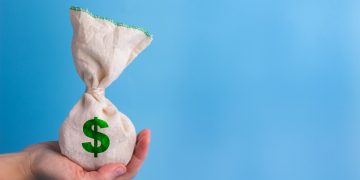 hand holding a money bag
