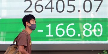 Asian shares tumble after wobbly day on Wall Street | Business and Economy