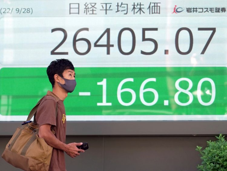 Asian shares tumble after wobbly day on Wall Street | Business and Economy