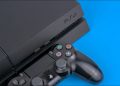 A Sony PS4 console with a DualShock controller next to it on a blue background.