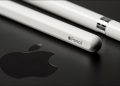 Closeup of an Apple Pencil on an top of an iPad, with the Apple logo visible.