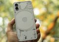 Nothing phone white in hand showing back