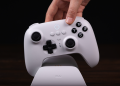 Plugging the 8BitDo Ultimate controller into its charging dock.