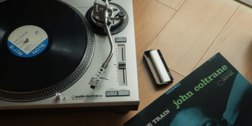 A John Coltrane LP next to an Audio-Technica turntable.