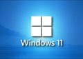 A stunning Windows 11 logo on a shaded blue landscape