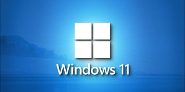 A stunning Windows 11 logo on a shaded blue landscape