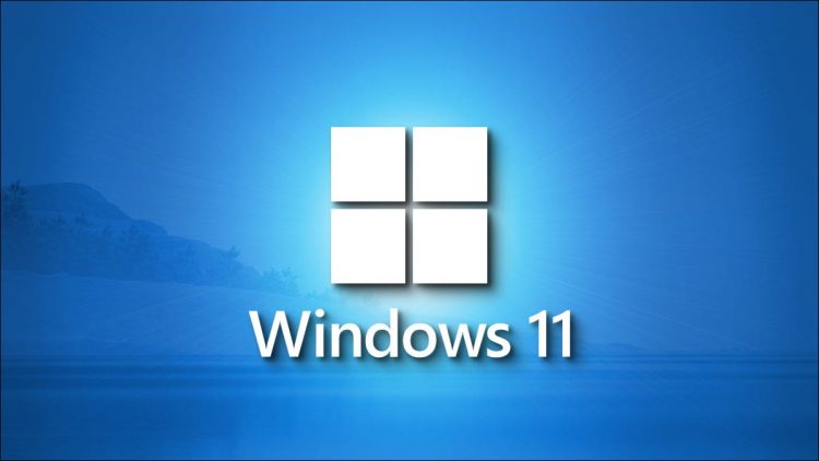 A stunning Windows 11 logo on a shaded blue landscape