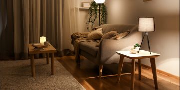 A cozy living room with warm lights.