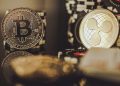 BTC Bitcoin and XRP Ripple Coins Between Casino Chips. Entertainment and Modern Blockchain Payments Concept.