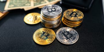 Bitcoin coins and money on the business desk