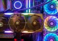 A GPU in a case colorfully lit by RGB lighting.