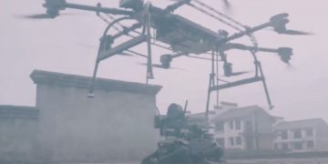 Here's video of a Chinese drone dropping off an armed robotic dog