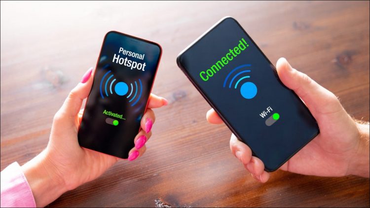 Two smartphones being held next to each other with Wi-Fi hotspot connection confirmations onscreen.