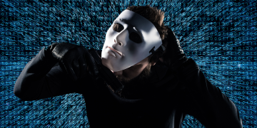 man taking off mask in front of digital background